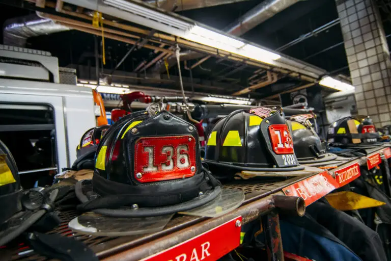 Firefighter helmets and equipment on standby, symbolizing readiness and bravery of fire service professionals.